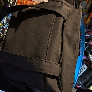 Black Messenger Bag with Durable Fabric and Structured Design